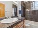 Modern bathroom featuring granite countertops, tiled shower, and updated fixtures at 471 S Grant St, Denver, CO 80209