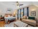 Inviting bedroom with natural light, a comfortable bed, and a cozy seating area at 471 S Grant St, Denver, CO 80209