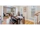 Open dining area featuring hardwood floors, stylish furnishings, and seamless flow to the living room at 471 S Grant St, Denver, CO 80209