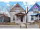 Victorian-style home with a covered front porch, showcasing its classic architectural details and curb appeal at 471 S Grant St, Denver, CO 80209