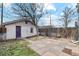 Garage exterior with a patio area, providing additional outdoor space with stone tiles at 471 S Grant St, Denver, CO 80209
