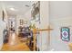 Elegant hallway with hardwood floors, decorative artwork, and staircase with stained glass window at 471 S Grant St, Denver, CO 80209