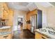 Charming kitchen featuring stainless steel appliances, stone countertops, and tiled floors at 471 S Grant St, Denver, CO 80209