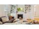 Inviting living room with a fireplace, built-in shelves, and comfortable furnishings, perfect for relaxation at 471 S Grant St, Denver, CO 80209