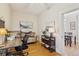 Well-lit office space with hardwood floors, modern desk, and comfortable seating area at 471 S Grant St, Denver, CO 80209