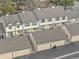 Aerial view of townhome roofs and back patios at 7068 E Briarwood Dr, Centennial, CO 80112