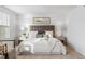 Bright bedroom filled with natural light, neutral decor, and comfortable furnishings at 7068 E Briarwood Dr, Centennial, CO 80112