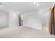 Neutral bedroom has bathroom access, carpet, and recessed track lighting at 7068 E Briarwood Dr, Centennial, CO 80112
