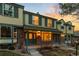 Inviting townhouse exterior with brick facade, covered porch, and cozy curb appeal at 7068 E Briarwood Dr, Centennial, CO 80112