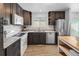 Functional kitchen with granite countertops, stainless steel appliances, and ample cabinet space at 7068 E Briarwood Dr, Centennial, CO 80112