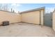 Concrete patio, tan siding, and privacy fence at 7068 E Briarwood Dr, Centennial, CO 80112