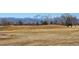 Scenic golf course view featuring rolling hills with mountain views in the background on a clear day at 909 Reynolds Farm Ln # C2, Longmont, CO 80503