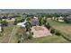 Aerial view of large home and property with white fence, geodesic dome, and horse pasture at 9353 E 146Th Ave, Brighton, CO 80602