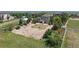 Aerial view of large property featuring mature trees, grass, and residence at 9353 E 146Th Ave, Brighton, CO 80602