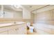 Tiled bathroom features a soaking tub, a neutral color palette, and a spacious vanity at 9353 E 146Th Ave, Brighton, CO 80602