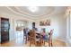 Formal dining room featuring hardwood floors, tray ceiling, and designer decor at 9353 E 146Th Ave, Brighton, CO 80602