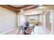Inviting dining room with large windows, light hardwood floors, and an elegant tray ceiling at 9353 E 146Th Ave, Brighton, CO 80602