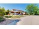 Beautiful home showcasing a covered front porch, stone accents, and mature landscaping at 9353 E 146Th Ave, Brighton, CO 80602