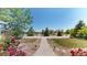 Lush landscaping lines the walkway of this wonderful property at 9353 E 146Th Ave, Brighton, CO 80602