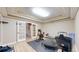 Private gym with workout equipment, and mirrored french doors at 9353 E 146Th Ave, Brighton, CO 80602