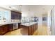 Open kitchen with stainless steel appliances and granite countertops, flowing into dining area at 9353 E 146Th Ave, Brighton, CO 80602