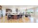 Open kitchen with an island bar flowing into a breakfast nook at 9353 E 146Th Ave, Brighton, CO 80602