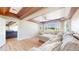 Cozy living room with sectional sofa, large windows, and views of the neighborhood at 9353 E 146Th Ave, Brighton, CO 80602