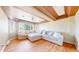 Comfortable living room with large sectional sofa, soft lighting, and views of the neighborhood at 9353 E 146Th Ave, Brighton, CO 80602