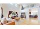 Bright living room with a soaring ceiling, large windows, and stylish, comfortable seating at 9353 E 146Th Ave, Brighton, CO 80602