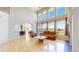 Spacious living room boasts large windows, hardwood floors, and open-concept layout at 9353 E 146Th Ave, Brighton, CO 80602