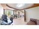 Spacious office features large windows, hardwood floors, and adjacent seating area at 9353 E 146Th Ave, Brighton, CO 80602
