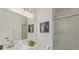 Bright bathroom featuring a vanity, glass enclosed shower, and decor at 10478 W 82Nd Ave, Arvada, CO 80005
