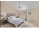 Inviting bedroom features a ceiling fan, neutral decor, and ample natural light at 10478 W 82Nd Ave, Arvada, CO 80005
