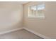 Neutral bedroom featuring carpet and a large window for natural light at 10478 W 82Nd Ave, Arvada, CO 80005