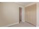 Bedroom featuring built-in closet and an open doorway at 10478 W 82Nd Ave, Arvada, CO 80005