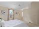 Bright bedroom with carpet, ceiling fan, neutral walls, and a window with natural light at 10478 W 82Nd Ave, Arvada, CO 80005