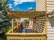 Inviting backyard deck featuring a pergola, grill, and cozy seating area for outdoor entertainment at 10478 W 82Nd Ave, Arvada, CO 80005