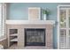 Elegant brick fireplace featuring built-in shelving and a decorative mantel, adding character to the living space at 10478 W 82Nd Ave, Arvada, CO 80005