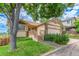 Beautiful home featuring a manicured lawn, inviting front porch with wood accents and a two-car garage at 10478 W 82Nd Ave, Arvada, CO 80005