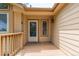Charming front porch with a light-colored wooden deck, offering a cozy and inviting entrance to the home at 10478 W 82Nd Ave, Arvada, CO 80005