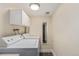 Laundry room with newer appliances and storage cabinets at 10478 W 82Nd Ave, Arvada, CO 80005