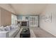 Comfortable living room featuring a brick fireplace, neutral-toned walls, and plush seating for a relaxed atmosphere at 10478 W 82Nd Ave, Arvada, CO 80005