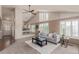 Bright and airy living room with high ceilings, large windows, and a comfortable seating area, ideal for gatherings at 10478 W 82Nd Ave, Arvada, CO 80005