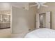 Spacious main bedroom leading to a bathroom with a large vanity area at 10478 W 82Nd Ave, Arvada, CO 80005