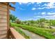 Picturesque backyard view of a winding river and lush greenery from a private deck at 10478 W 82Nd Ave, Arvada, CO 80005