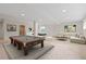 Finished basement with a pool table, foosball, and comfortable seating at 20816 E Shefield Pl, Parker, CO 80138