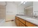 Bathroom featuring a double vanity, granite countertop and a tub and shower combo at 20816 E Shefield Pl, Parker, CO 80138