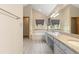 Bright bathroom with double vanity, granite countertops, soaking tub, and modern finishes at 20816 E Shefield Pl, Parker, CO 80138