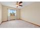 Bedroom with a ceiling fan and a large window offering plenty of natural light at 20816 E Shefield Pl, Parker, CO 80138
