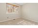 Cozy bedroom with neutral carpet, window with blinds, and natural light at 20816 E Shefield Pl, Parker, CO 80138